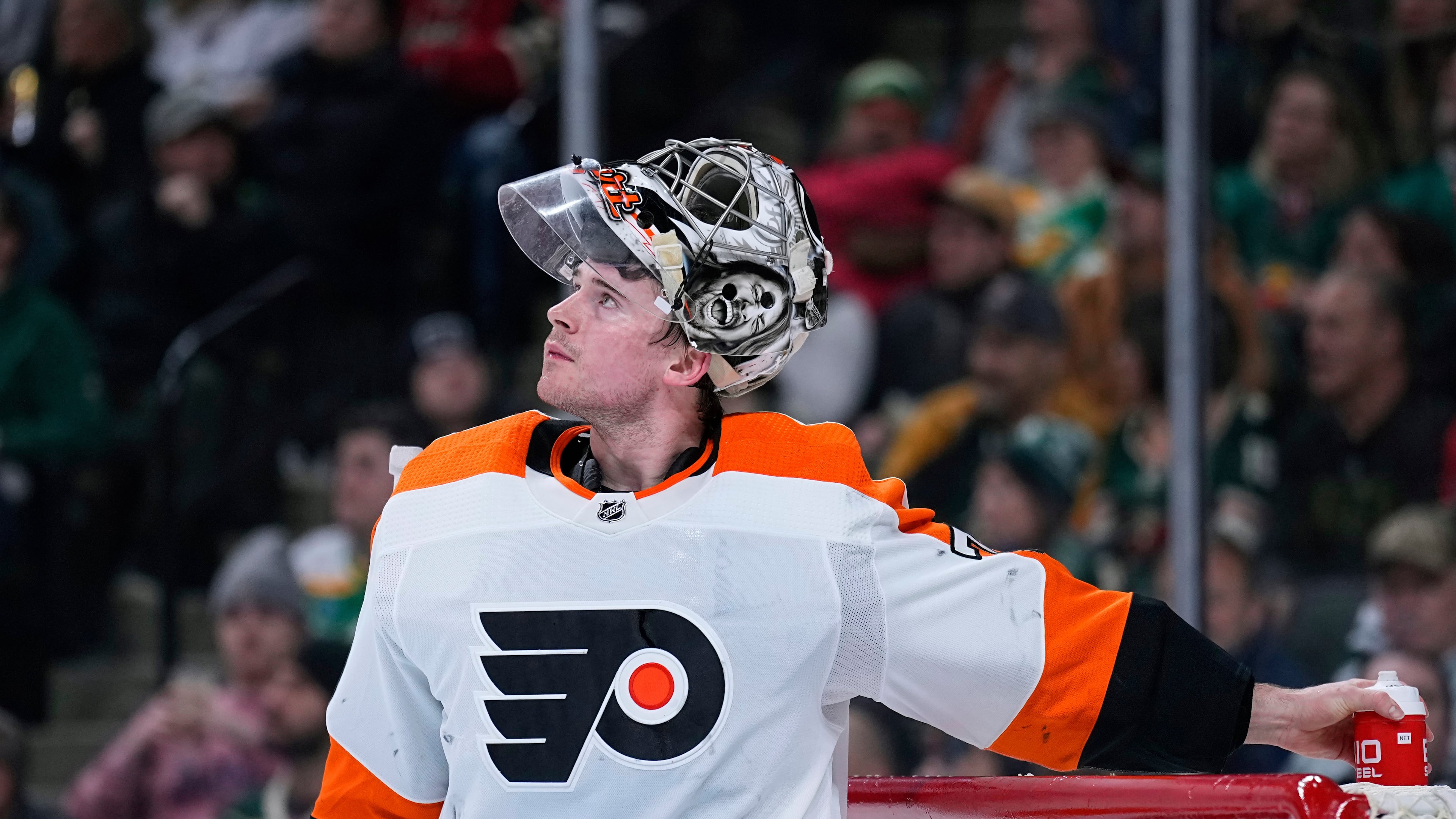 FILE - Philadelphia Flyers goaltender Carter Hart waits for play to resume during the third period of an NHL hockey game against the Minnesota Wild, Thursday, Jan. 26, 2023, in St. Paul, Minn. (AP Photo/Abbie Parr, File)