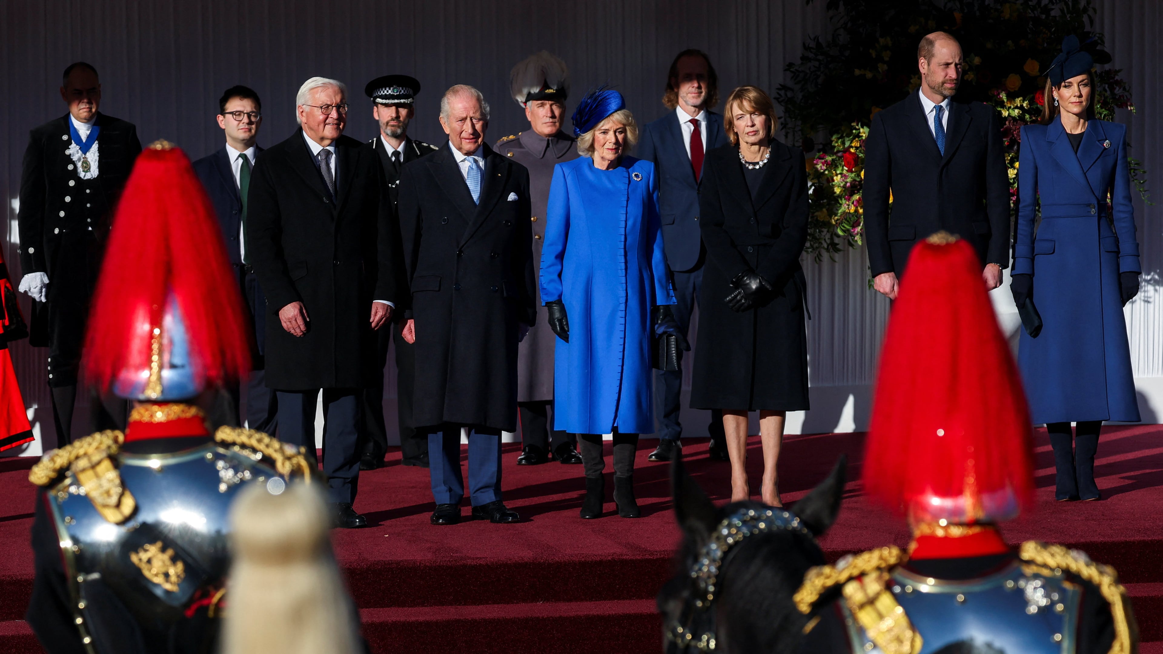 On the stage from left, German President Frank-Walter Steinmeier, Britain's King Charles III, Queen Camilla, wife of Steinmeier Elke Buedenbender, Prince William and Kate, Princess of Wales, attend a welcome ceremony on the Royal Dais at Datchet Road, in Windsor, England, Wednesday, Dec. 3, 2025. (Toby Melville/Pool Photo via AP)