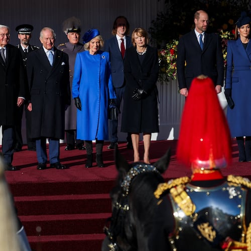 On the stage from left, German President Frank-Walter Steinmeier, Britain's King Charles III, Queen Camilla, wife of Steinmeier Elke Buedenbender, Prince William and Kate, Princess of Wales, attend a welcome ceremony on the Royal Dais at Datchet Road, in Windsor, England, Wednesday, Dec. 3, 2025. (Toby Melville/Pool Photo via AP)