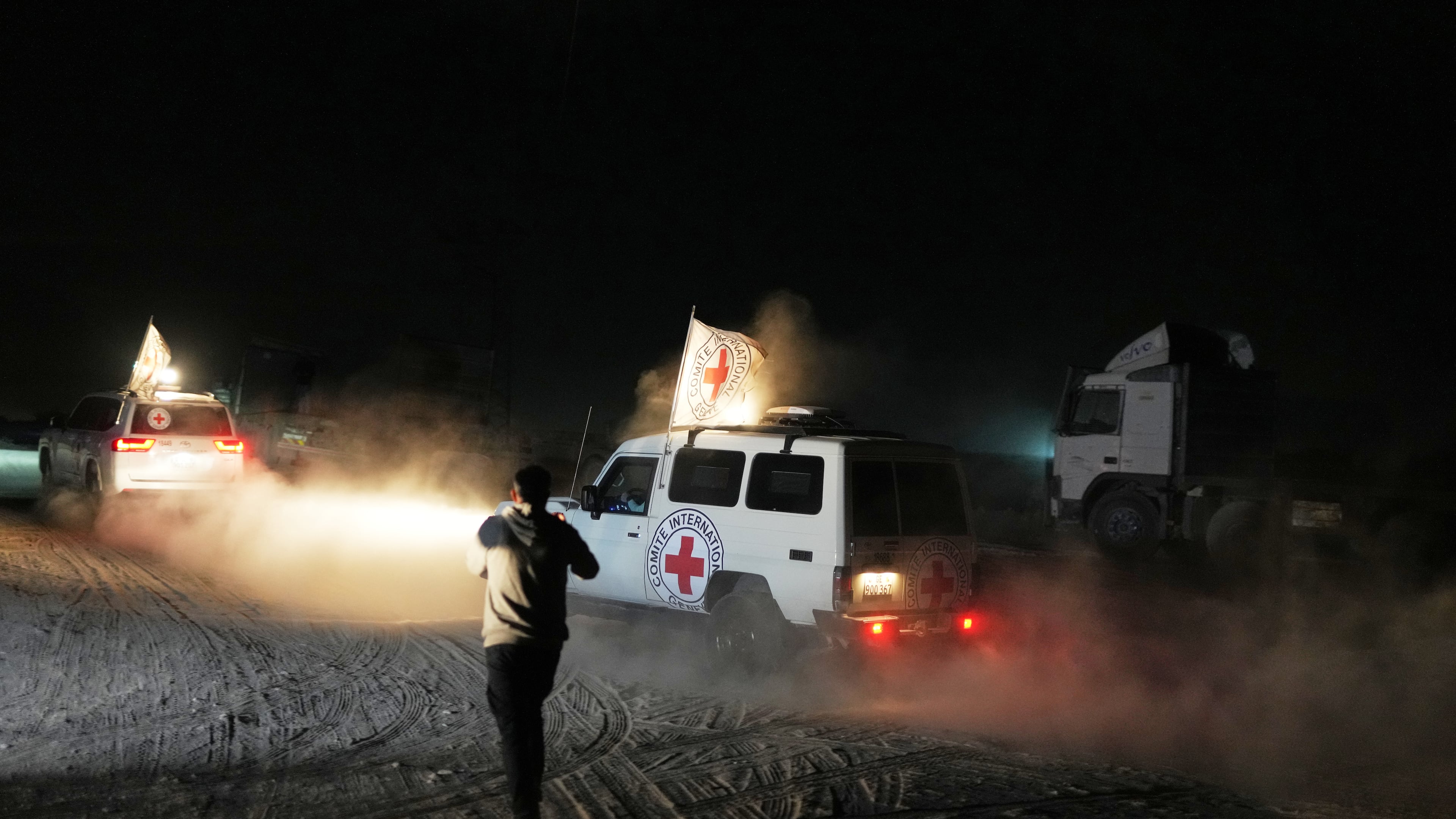 Red Cross convoy carrying the body of a person believed to be a deceased hostage handed over by Hamas militants makes its way toward the border crossing with Israel, to be transferred to Israeli authorities, in Deir al-Balah, central Gaza Strip, Thursday, Nov. 13, 2025. (AP Photo/Abdel Kareem Hana)