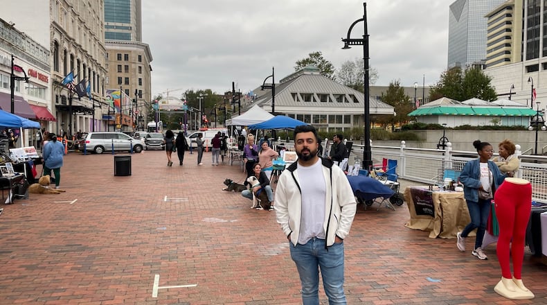 Shaneel Lalani, Underground Atlanta's owner, stands on Upper Alabama Street in November. Photo by Bill Torpy