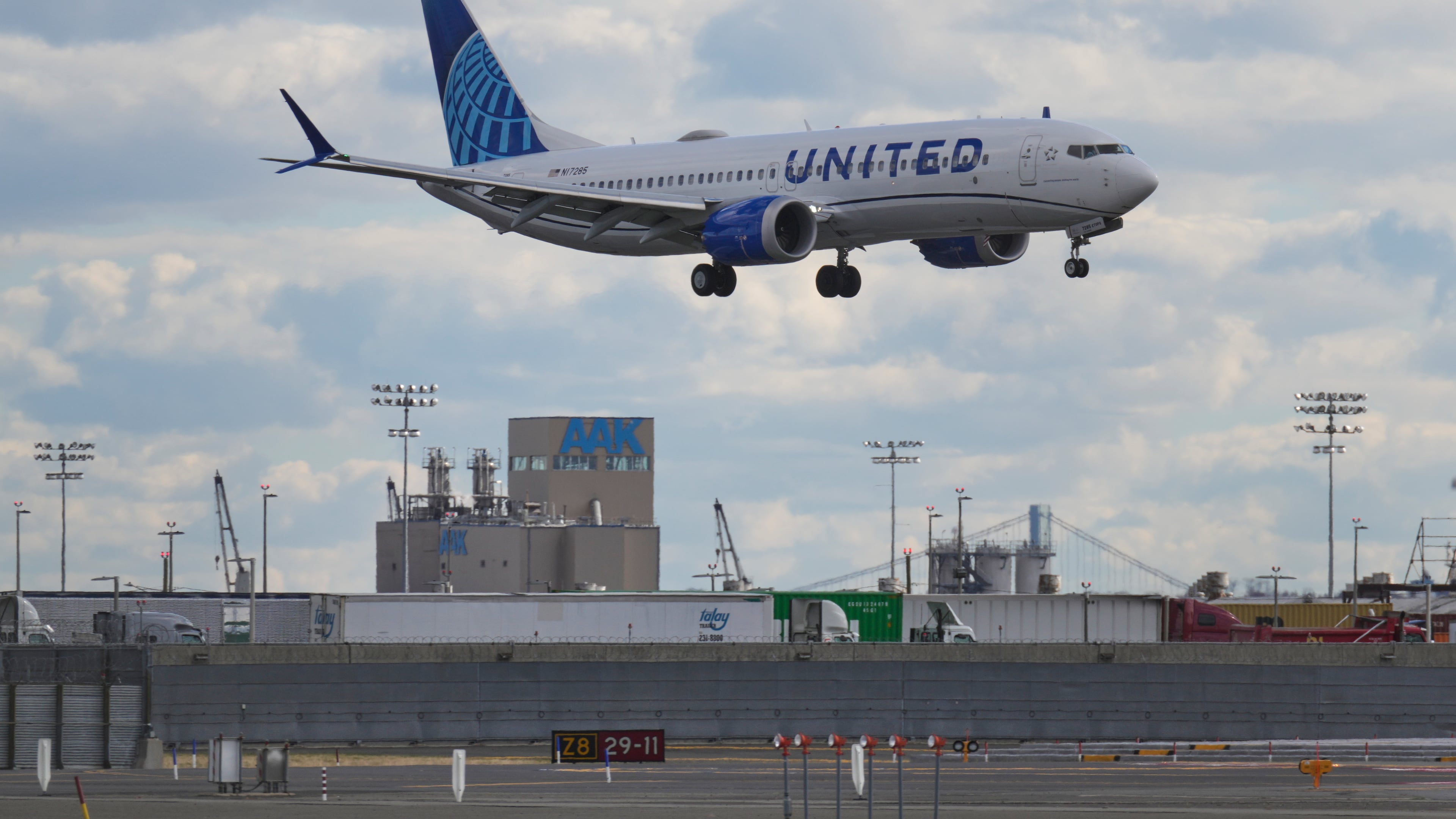 A plane lands at Newark International Airport in Newark, N.J., Thursday, Nov. 6, 2025. (AP Photo/Seth Wenig)