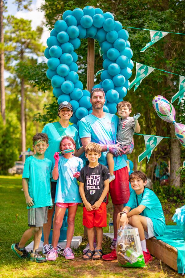Kim Airhart smiles with her husband Chris and their five children (from left to right) Carter, Kate, Harrison, Holden, and Hayes. Photo provided by Kim Airhart