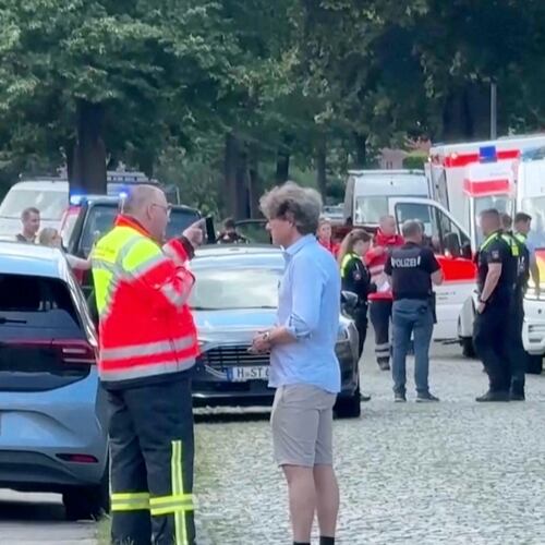 In this image taken from a video, emergency responders, residents and police in Stade, Germany, Monday, June 29, 2026 after five people were killed in a shooting on Monday at a youth welfare facility in the northern German town of Stade, police said. (NWM-TV via AP)