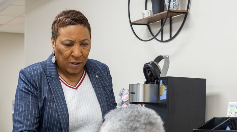 A.G. Rhodes Atlanta administrator Loretta Barnes gets a cup of coffee for a resident at the Cobb County nursing home. PHIL SKINNER FOR THE ATLANTA JOURNAL-CONSTITUTION