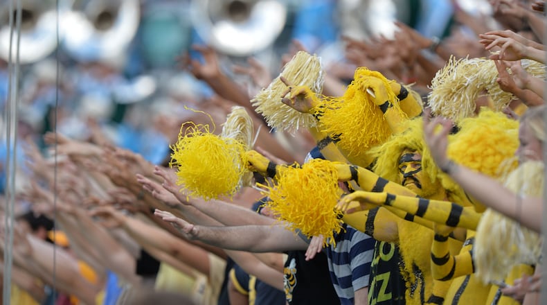 Georgia Tech Yellow Jackets fans cheers in the first half against the Tulane Green Wave at Bobby Dodd Stadium on Saturday, September 12, 2015. HYOSUB SHIN / HSHIN@AJC.COM