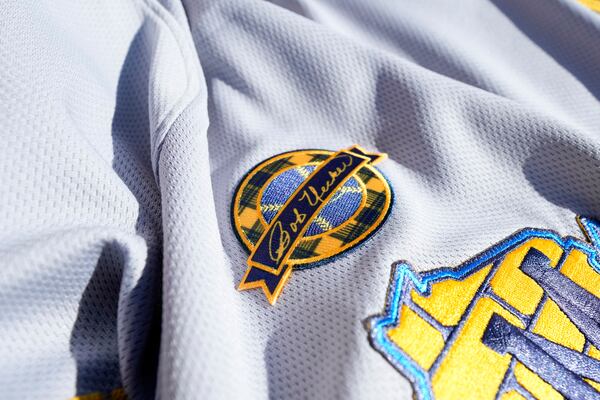 A Bob Uecker memorial patch adorns a Milwaukee Brewers jersey at a baseball game against the Kansas City Royals, Monday, March 31, 2025, in Milwaukee. (AP Photo/Kayla Wolf)