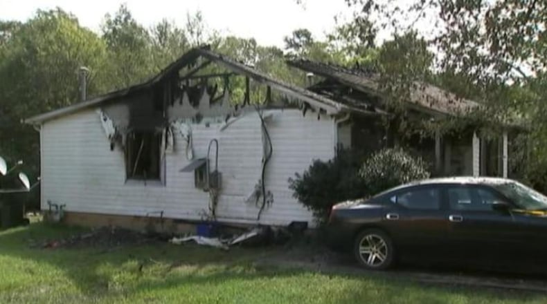 Neighbors told WSOC-TV that a South Carolina woman died Saturday morning when she attempted to run back inside a burning house to save her children.