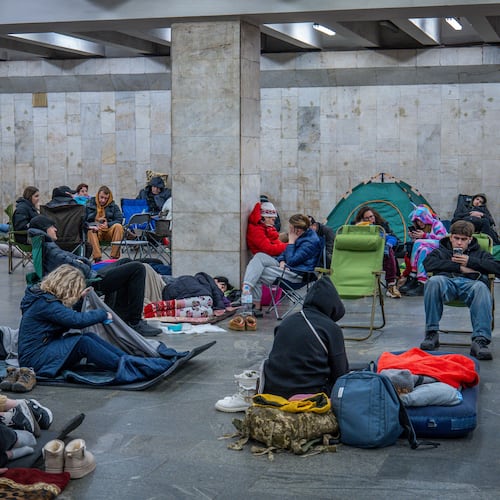 People hide in a metro station, being used as a bomb shelter, during a Russian drones attack in Kyiv, Ukraine, early Friday, Nov. 14, 2025. (AP Photo/Dan Bashakov)