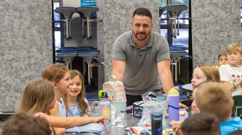 Kelly Mill Elementary School custodian Richard Toomey, who was named national Custodian of the Year by Cintas Corporation chats with students. The annual Cintas Custodian of the Year contest honors standout school custodians. PHIL SKINNER FOR THE ATLANTA JOURNAL-CONSTITUTION