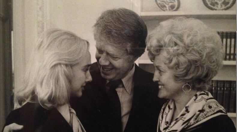 Sheri Mann Stewart (from left), former President Jimmy Carter and Connie Stewart share a hug in the White House during Carter's tenure in 1970s. Connie Stewart worked on the team that created the Department of Education during Carter's administration. (Courtesy of Sheri Mann Stewart)