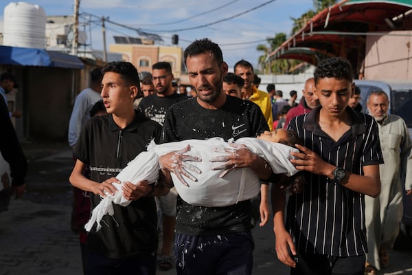 Relatives of Palestinian child, Massa Abed, 4, who was killed in an Israeli army airstrike on the Gaza Strip, carry her body at Al-Aqsa Hospital in Deir al-Balah, Gaza, Sunday, April 27, 2025. (AP Photo/Abdel Kareem Hana)