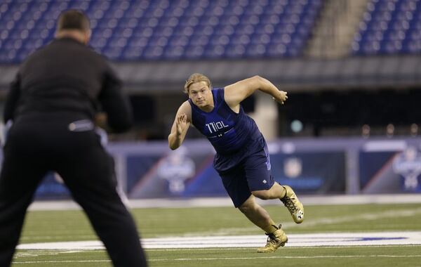 Iowa offensive lineman Andrew Donnal runs a drill at the NFL football scouting combine in Indianapolis, Friday, Feb. 20, 2015. (AP Photo/David J. Phillip)