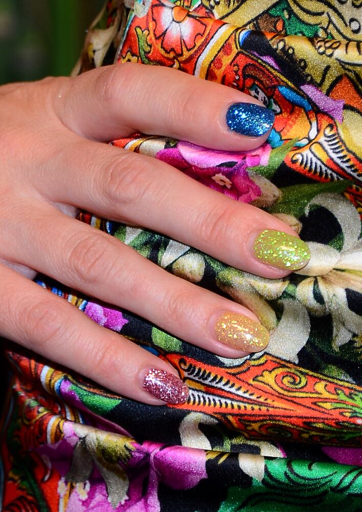 This girl next door likes her nails candy-colored. Who is it?