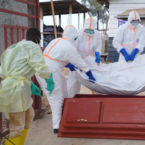 Health workers who are members of the safe and dignified burial team prepare to bury Abineno Justine, a 38 year old woman who died of the Ebola virus, in Bunia, Congo, Friday, Sept. 4, 2026. (AP Photo/Dieudonne Dirole)