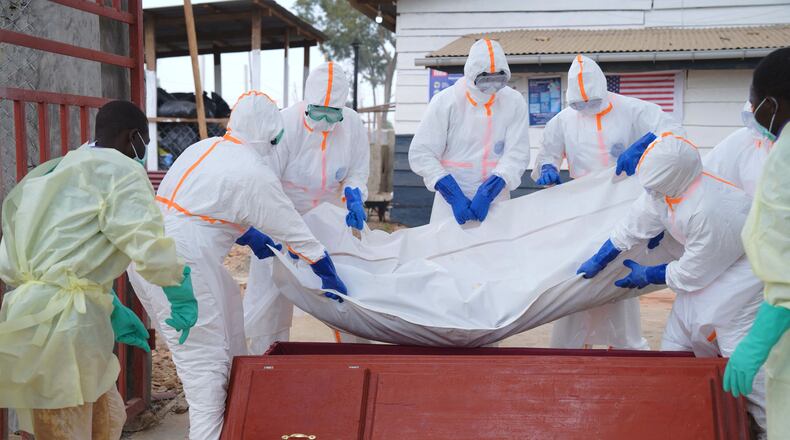 Health workers who are members of the safe and dignified burial team prepare to bury Abineno Justine, a 38 year old woman who died of the Ebola virus, in Bunia, Congo, Friday, Sept. 4, 2026. (AP Photo/Dieudonne Dirole)