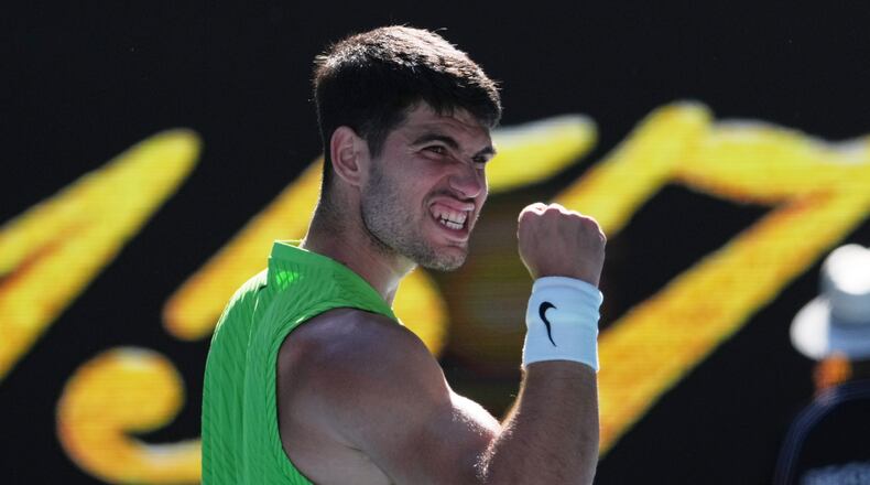 Carlos Alcaraz of Spain celebrates after defeating Yannick Hanfmann of Germany in their second round match at the Australian Open tennis championship in Melbourne, Australia, Wednesday, Jan. 21, 2026. (AP Photo/Dita Alangkara)