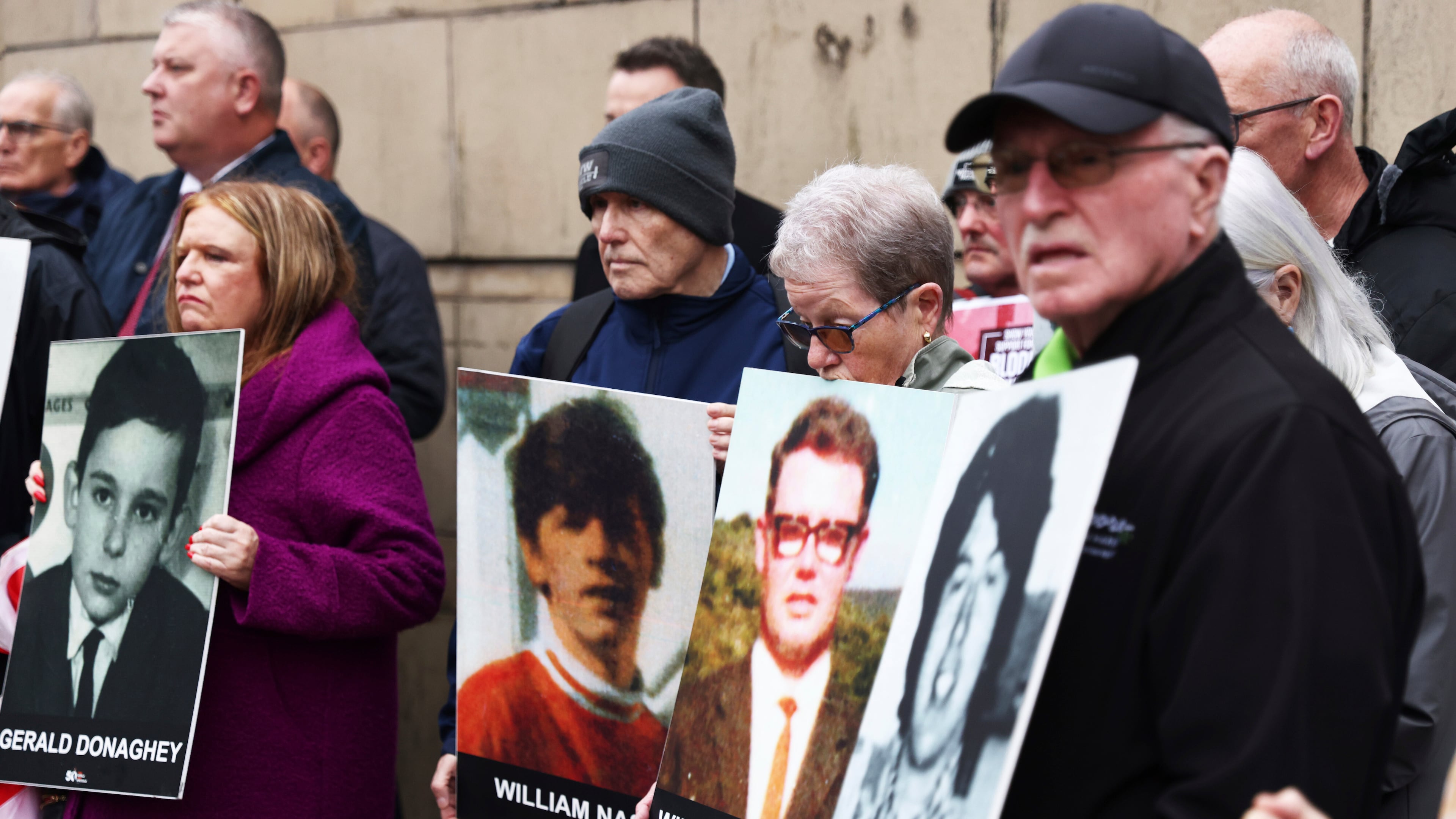 FILE - Families of the victims of the 1972 Bloody Sunday, hold a protest outside Belfast Crown court, Northern Ireland, Monday Sept. 15, 2025. (AP Photo/Peter Morrison, File)