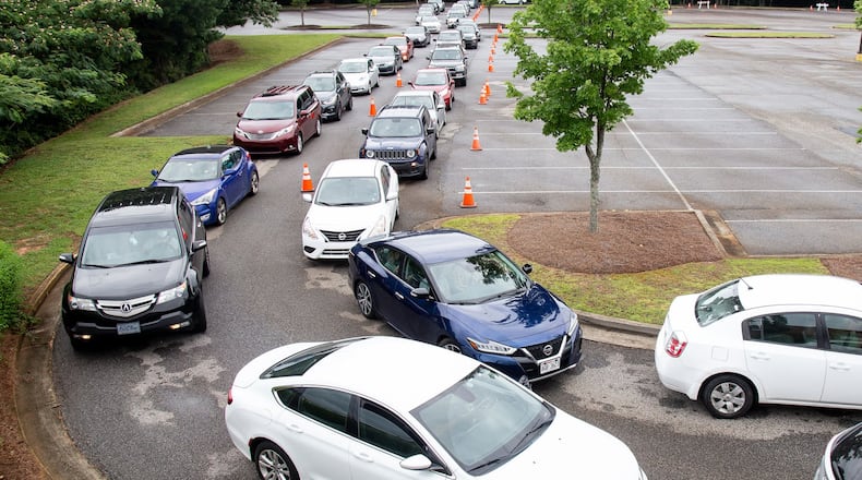 Cars line up at the COVID 19 testing center at Greenforest Community Baptist Church in Decatur July 01, 2020. STEVE SCHAEFER FOR THE AJC