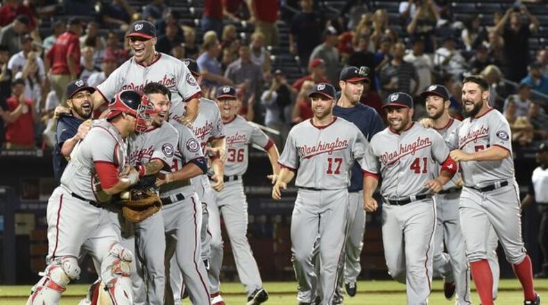 The Nationals celebrated winning the NL East title Tuesday night at Turner Field, the latest indignation for the skidding Braves.