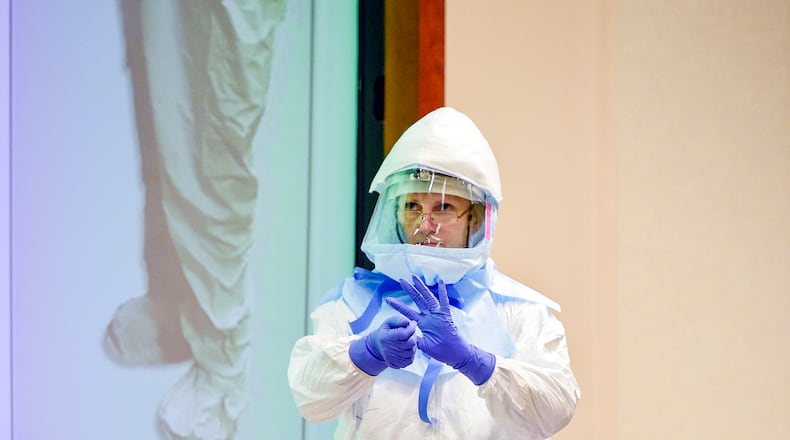 Emory University Hospital nurse Jill Morgan in PPE during a 2015 National Emerging Special Pathogens Training and Education Center (NETEC) training session at Emory. Photo by Jack Kearse/ Emory Health Sciences Photography.