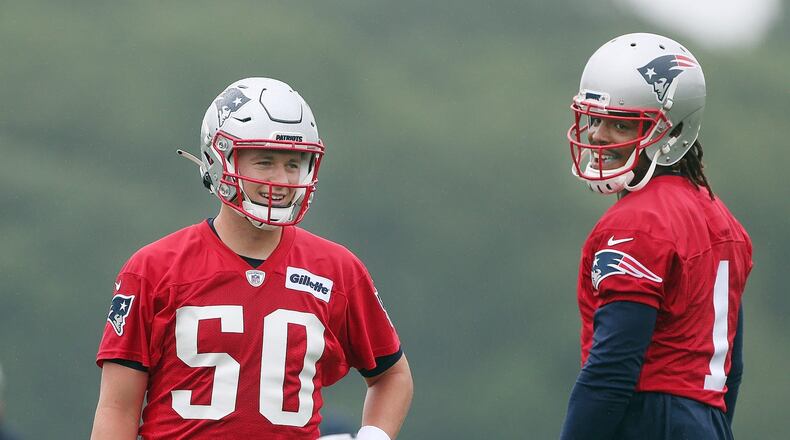 Foxborough, Mass., July 28, 2021 — Patriot QBs Mac Jones (50) and Cam Newton (1) work through a drill during Patriots training camp at Gillette Stadium. (Bob Breidenbach/The Providence Journal/TNS)