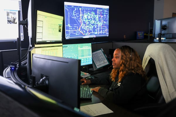A Georgia Tech communications officer works inside the Operations Center of the Georgia Tech Police Department, Monday, May 12, 2025, in Atlanta. (Jason Getz / AJC)