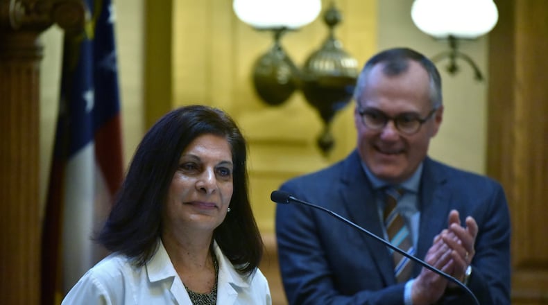 Gulshan Harjee, who grew up in Tanzania, speaks to the Georgia Senate in January as Lt. Gov. Casey Cagle (background) looks on. She graduated from Morehouse School of Medicine. HYOSUB SHIN / HSHIN@AJC.COM