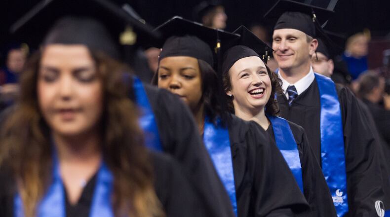 Georgia State University students return to their seats during the morning graduation ceremony in Atlanta Ga. Tuesday 9, 2017. With two ceremonies Georgia State University graduated nearly 2000 students Tuesday. STEVE SCHAEFER / SPECIAL TO THE AJC