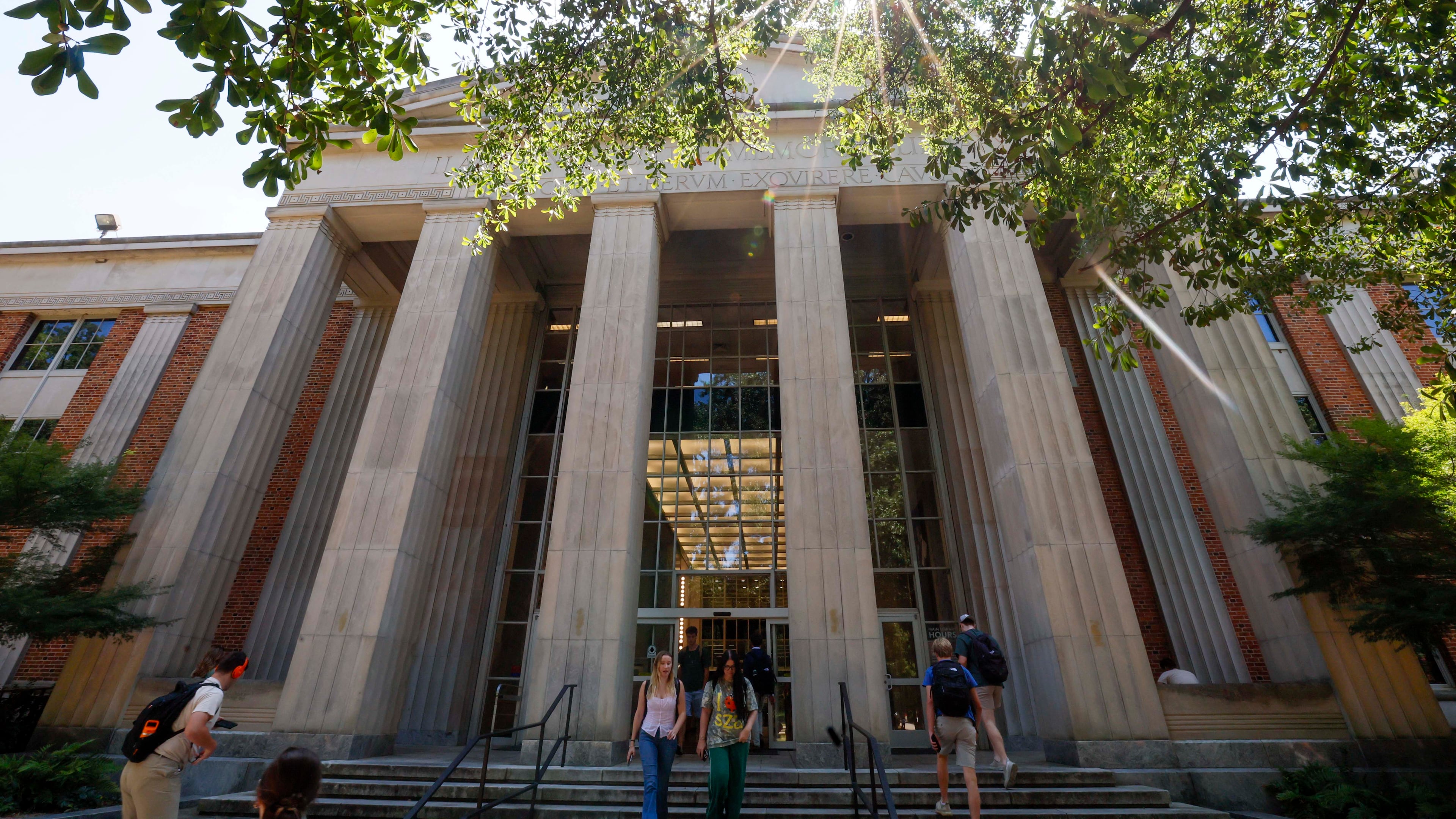 University of Georgia students are seen entering and leaving the main Library on the Athens campus on Monday, Sept. 8, 2025. (Miguel Martinez/AJC)