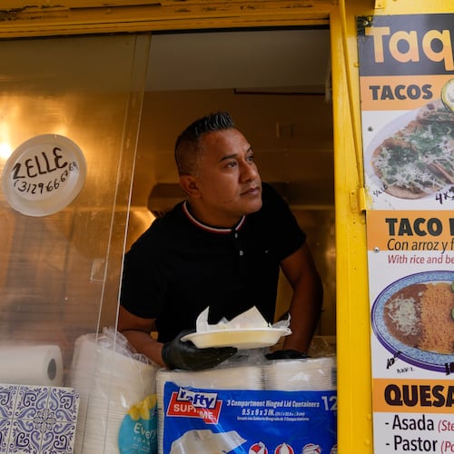 Rafael Hernandez, originally from Mexico, sells food from his family's food truck, Nov. 6, 2025, in Chicago. (AP Photo/Erin Hooley)