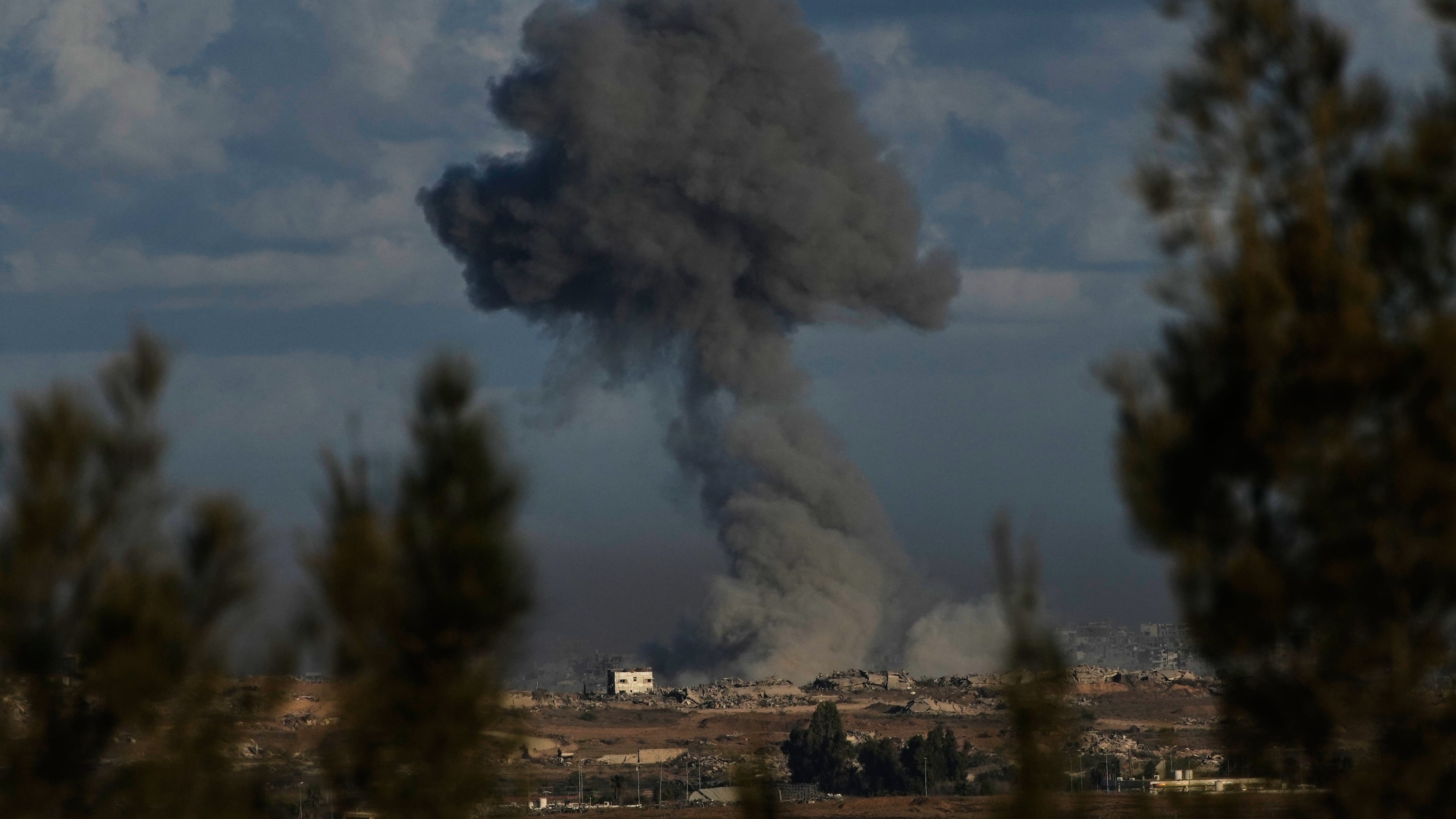 Smoke rises following an Israeli army bombardment in the Gaza Strip, as seen from Kibbutz Kfar Aza, southern Israel, Tuesday, Oct. 7, 2025. (AP Photo/Ohad Zwigenberg)