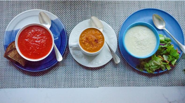 Tomato Soup, Spiced Sweet Potato Soup and Cauliflower Parmesan Soup offer quick and easy comfort. Food styling by Cynthia Graubart
(Virginia Willis for The Atlanta Journal-Constitution)