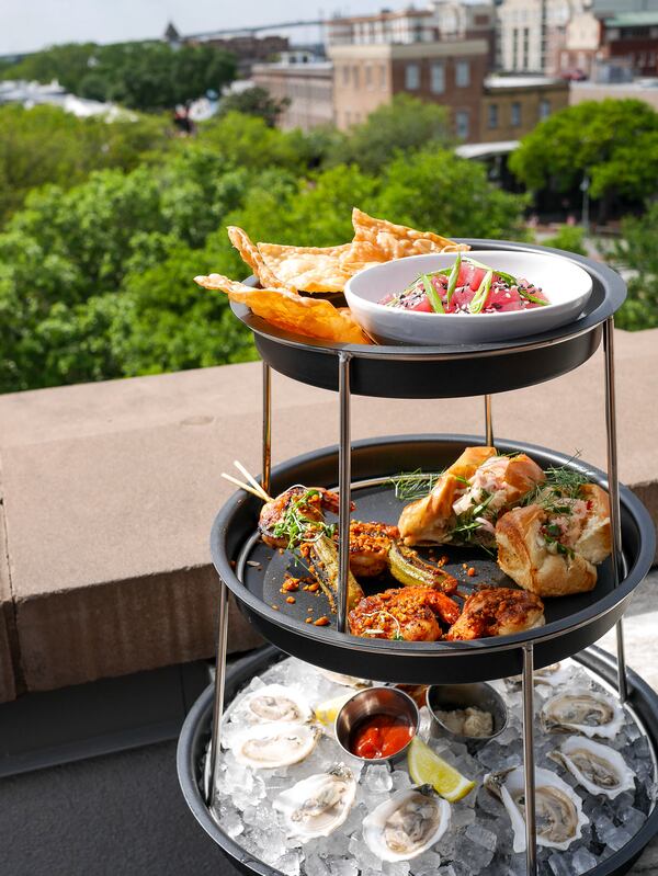The Neon Fish's seafood tower with Sorry Charlie's Bull River Oysters, grilled shrimp skewers, mini lobster rolls and tuna tartare served with crispy wonton chips. (Courtesy of Sorry Charlie's)