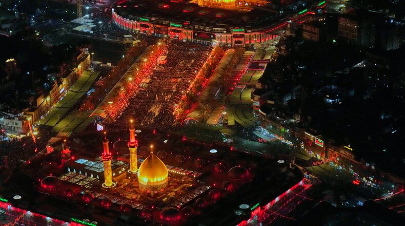 Aerial photo shows Shiite pilgrims gathering between the holy shrine of Imam Hussein and the holy shrine of Imam Abbas ahead of Arbaeen, the annual Shiite commemoration marking 40 days after Ashura, in Karbala, Iraq, Sunday, Aug. 2, 2026. (AP Photo/Hadi Mizban)
