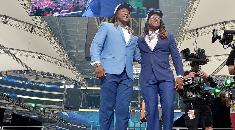 The Seattle Seahawks selected UCF linebacker Shaquem Griffin, left, joining his twin brother Shaquill on the team, in the fifth round, 141st overall, during the final day of the 2018 NFL Draft at AT&T Stadium in Arlington, Texas, on Saturday, April 28, 2018. (Max Faulkner/Fort Worth Star-Telegram/TNS)