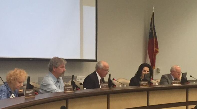 Gwinnett County school board members discuss school textbooks in this file photo from 2016.