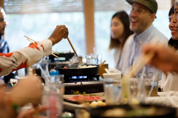 Freedom University students, staff and guests are seen enjoying a celebratory dinner marking the conclusion of the virtual study abroad Japan program at Nakato restaurant in Atlanta on Sunday, Aug. 23, 2026. (Miguel Martinez/AJC)