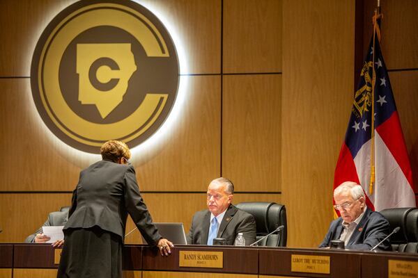 Superintendent Chris Ragsdale and school board member Randy Scamihorn (right) before the public portion of the Cobb County School Board monthly meeting Thursday, June 9, 2022. (Jenni Girtman for The Atlanta Journal-Constitution)