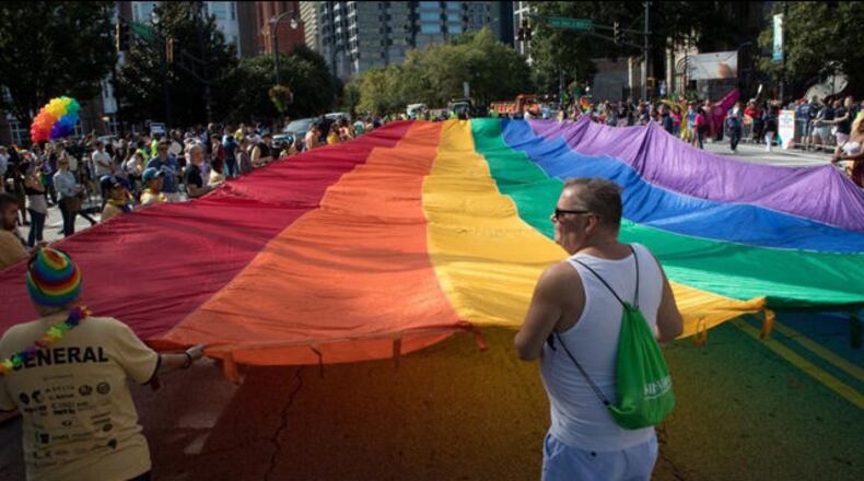The 2018 edition of the annual parade at Atlanta Pride  makes its way down Peachtree Street .
