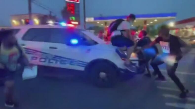 A Detroit Police Department SUV plowed into a crowd of protesters who surrounded the cruiser and refused to move Sunday night, launching two people off the hood and hurling several others to the ground before speeding away, according to reports, citing video footage of the incident. There were no serious injuries, although some needed treatment at local hospitals, according to reports.