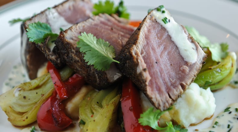 Seared rare ahi tuna, roasted butternut squash, portabello mushroom, ginger soy glaze, crispy onion straws. (BECKY STEIN)