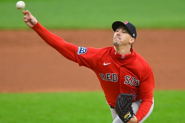 Boston Red Sox starting pitcher Walker Buehler delivers against the Cleveland Guardians during the first inning of the second baseball game of a doubleheader, Saturday, April 26, 2025, in Cleveland, (AP Photo/David Richard)