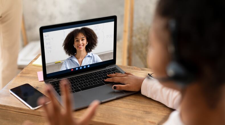 "Setting up a tri-fold board or a sheet behind the desk can also help to eliminate distractions for others who are watching the kid through Zoom, so they're just seeing a blank background," says Sierra Filucci, mother of two and editorial director at Common Sense Media, an education and family advocacy organization that recently launched Wide Open School, a platform full of distanced learning resources for parents. (Dreamstime/TNS)