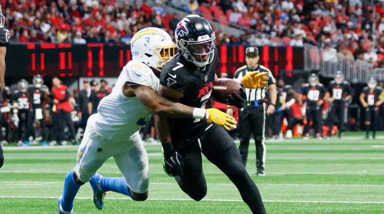 Atlanta Falcons running back Bijan Robinson (7) runs for yards during the first half of an NFL football game against the Los Angeles Chargers on Sunday, Dec. 1, 2024, at Mercedes-Benz Stadium in Atlanta. (Miguel Martinez/AJC)