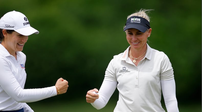 Ryann O'Toole, right, and Albane Valenzuela, left, celebrate on the 16th green during the first round of the Dow Championship LPGA golf tournament, Thursday, June 11, 2026, at Midland Country Club in Midland, Mich. (AP Photo/Al Goldis)