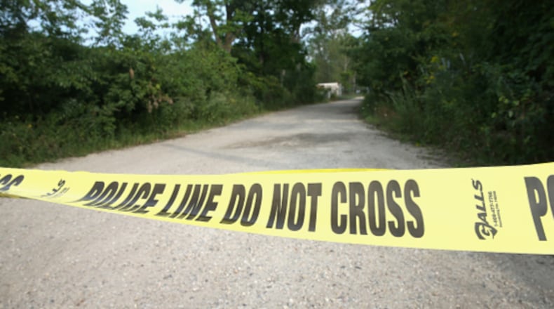 Crime scene tape is pictured here. Authorities in metro Atlanta are searching for the body of a 78-year-old woman police believe was killed by her grandson with a ‘Rambo-style’ knife. The grandson was caught driving the woman’s car last week.