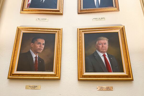 Portraits of President Donald Trump and former President Barack Obama hang in the Capitol Rotunda in Denver on Monday, March 24, 2025. (AP Photo/Jesse Bedayn)