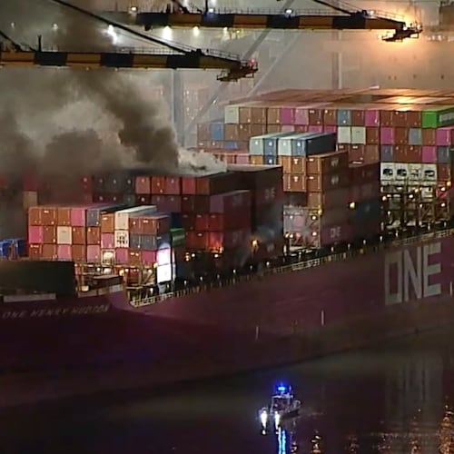 This image taken from video provided by ABC7 shows smoke rising from a blaze on a container ship docked at the Port of Los Angeles, Friday, Nov. 21, 2025, in Los Angeles. (ABC7 via AP)