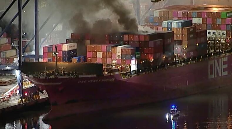 This image taken from video provided by ABC7 shows smoke rising from a blaze on a container ship docked at the Port of Los Angeles, Friday, Nov. 21, 2025, in Los Angeles. (ABC7 via AP)